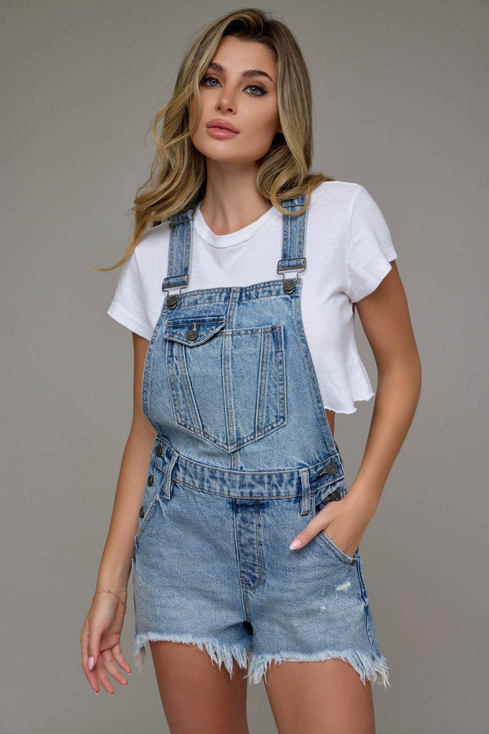 The Sonya Medium Wash Frayed Hem Overall shorts