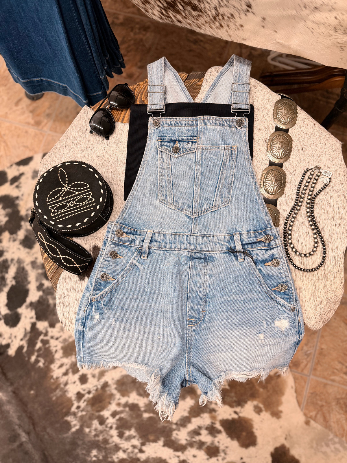 The Sonya Medium Wash Frayed Hem Overall shorts