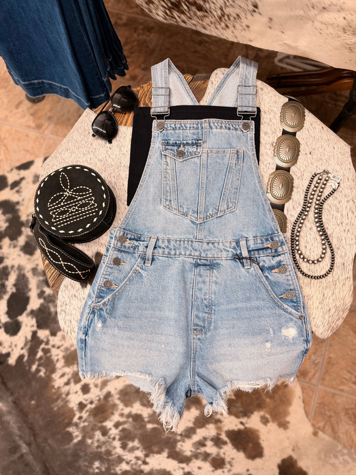 The Sonya Medium Wash Frayed Hem Overall shorts