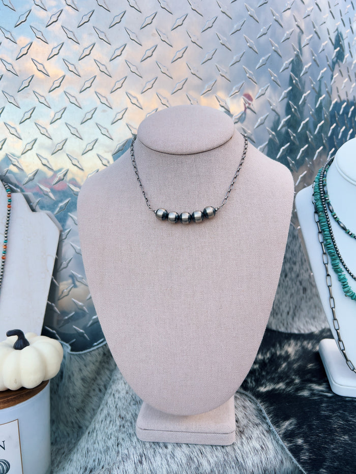 The Five Pearl Necklace