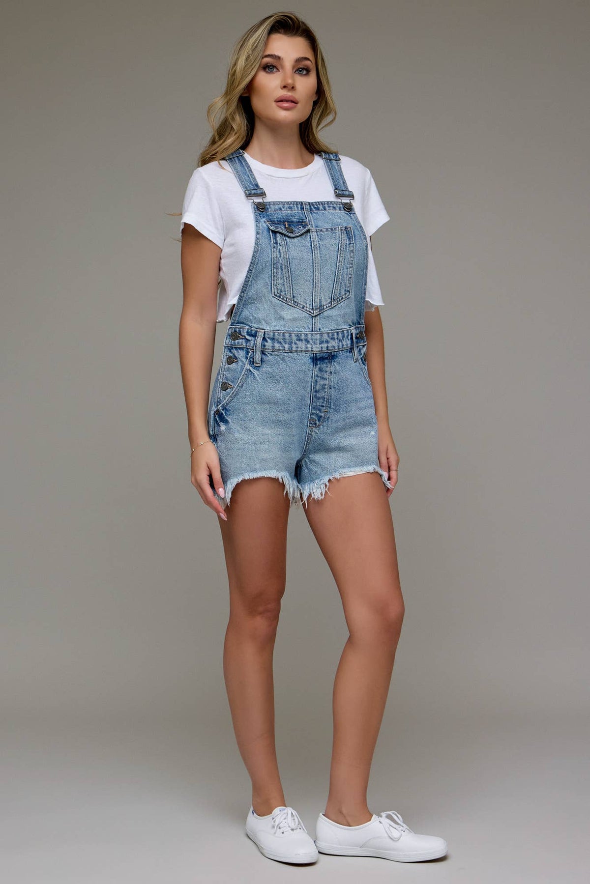 The Sonya Medium Wash Frayed Hem Overall shorts