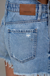 The Sonya Medium Wash Frayed Hem Overall shorts